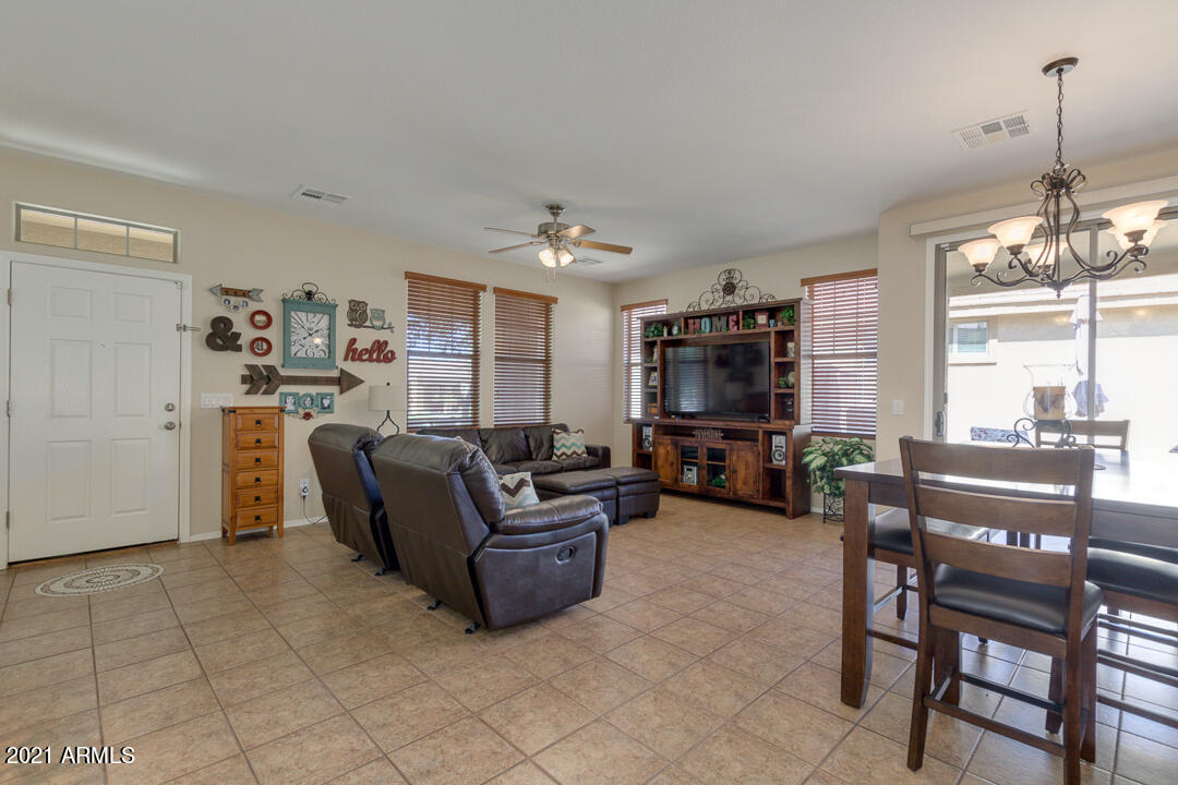3763 East Larson Lane Gilbert, AZ 85295 - Photo 7 of 40 a living room with furniture and a flat screen tv