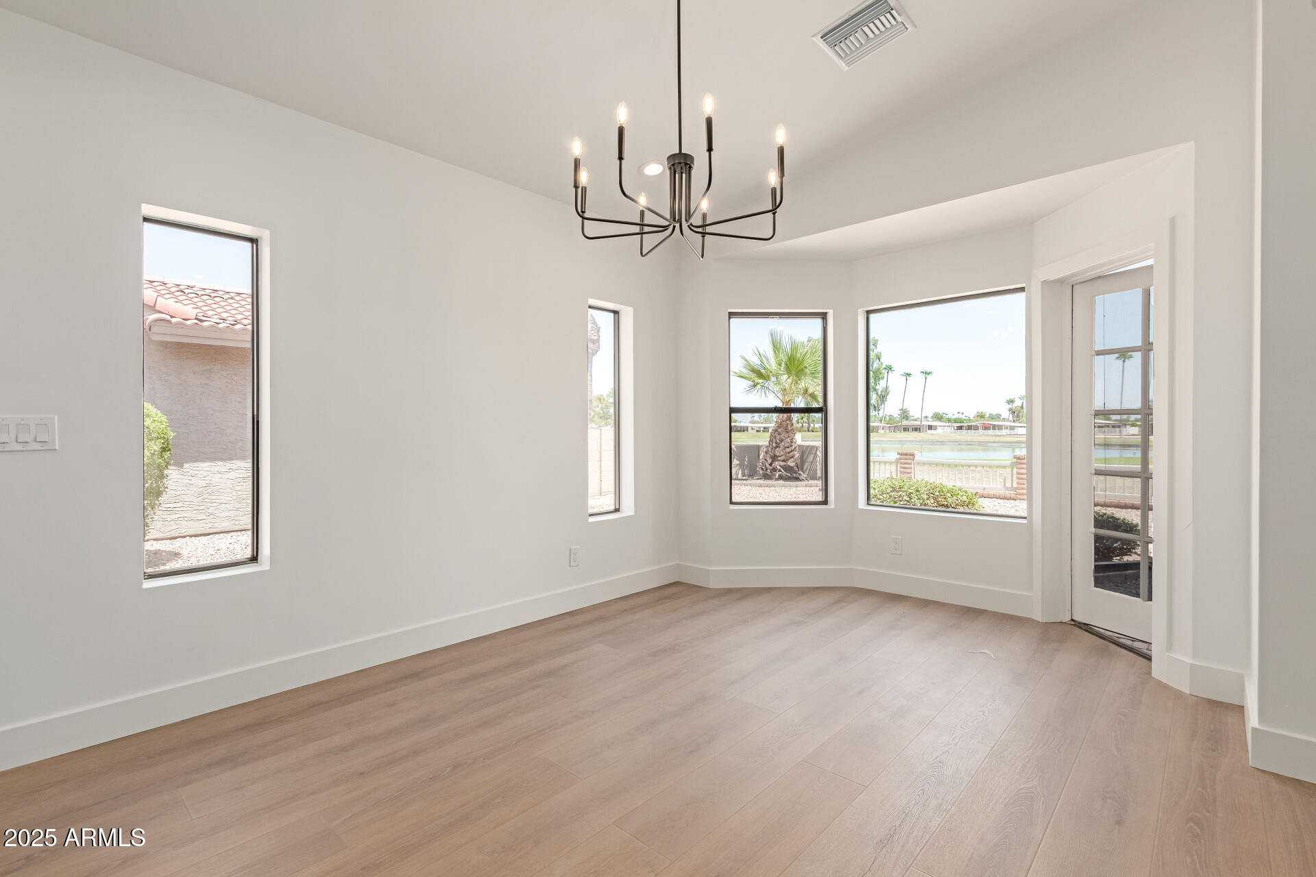8883 East Fairway Boulevard Sun Lakes, AZ 85248 - Photo 11 of 30 a view of an empty room with a window