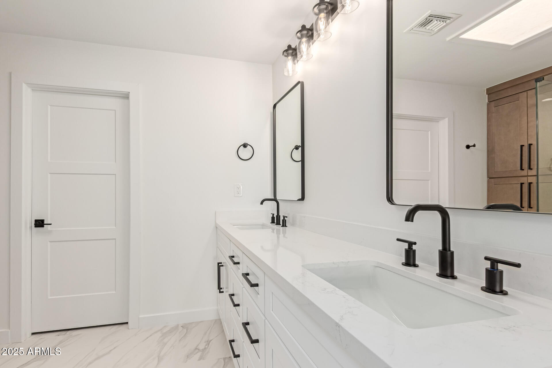 8883 East Fairway Boulevard Sun Lakes, AZ 85248 - Photo 14 of 30 a bathroom with a double vanity sink a mirror and shower