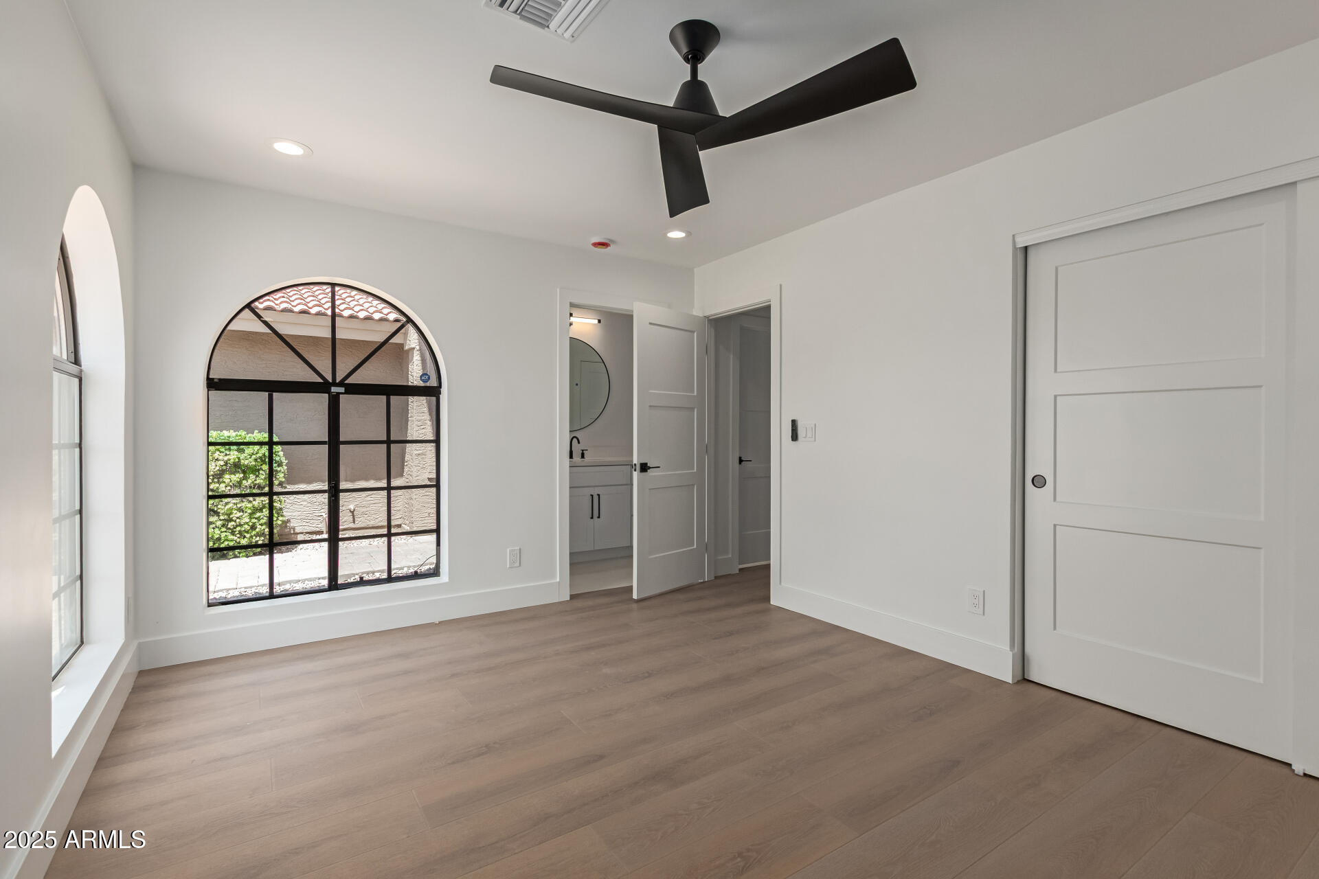 8883 East Fairway Boulevard Sun Lakes, AZ 85248 - Photo 17 of 30 wooden floor in an empty room with a window