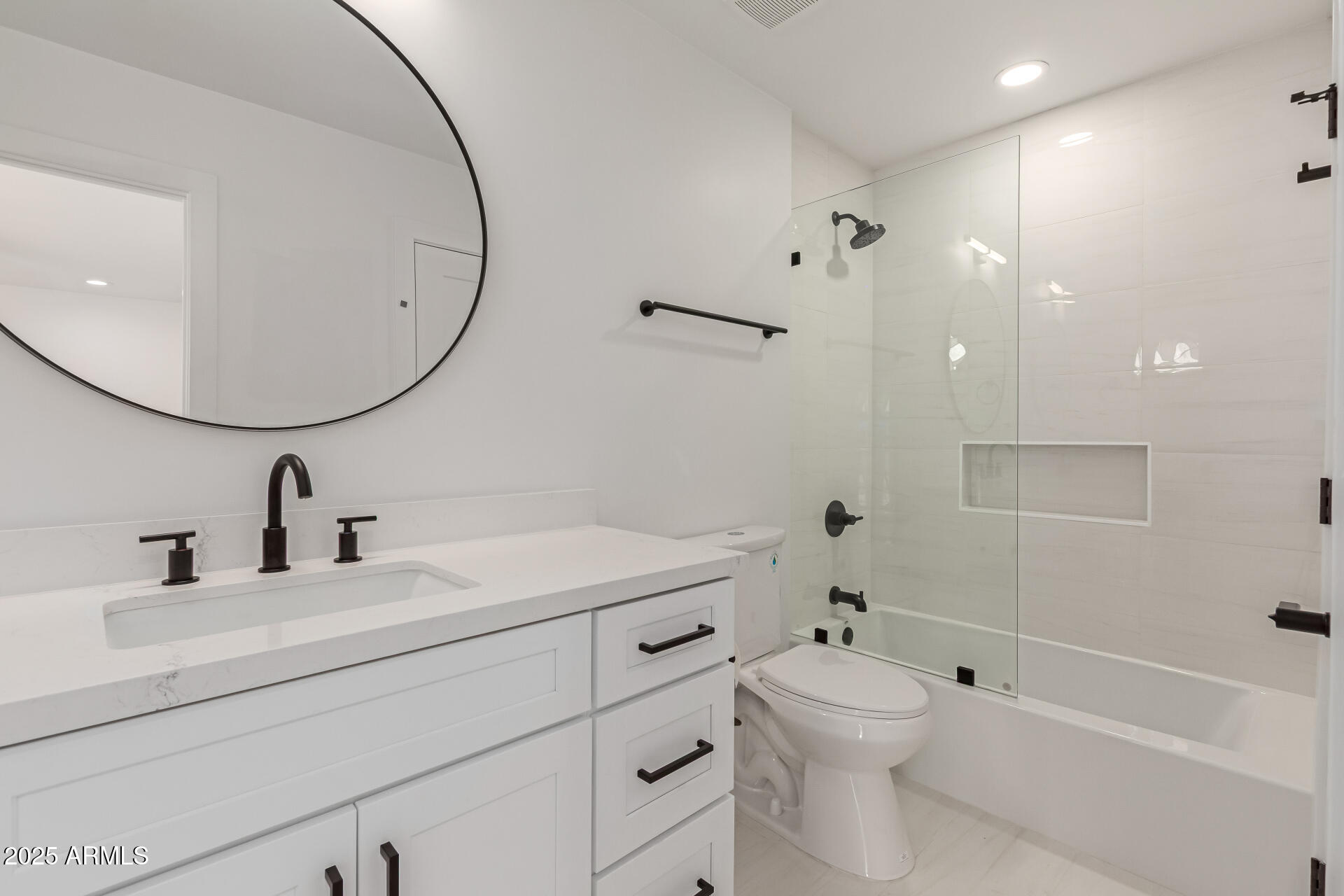 8883 East Fairway Boulevard Sun Lakes, AZ 85248 - Photo 18 of 30 a bathroom with a sink a toilet and a mirror