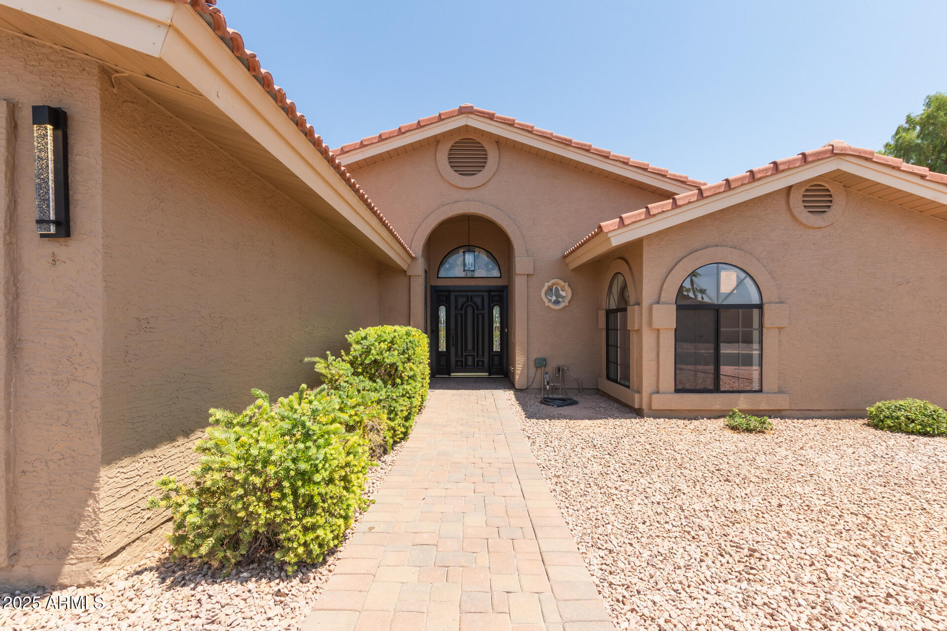 8883 East Fairway Boulevard Sun Lakes, AZ 85248 - Photo 2 of 30 a front view of a house with a yard