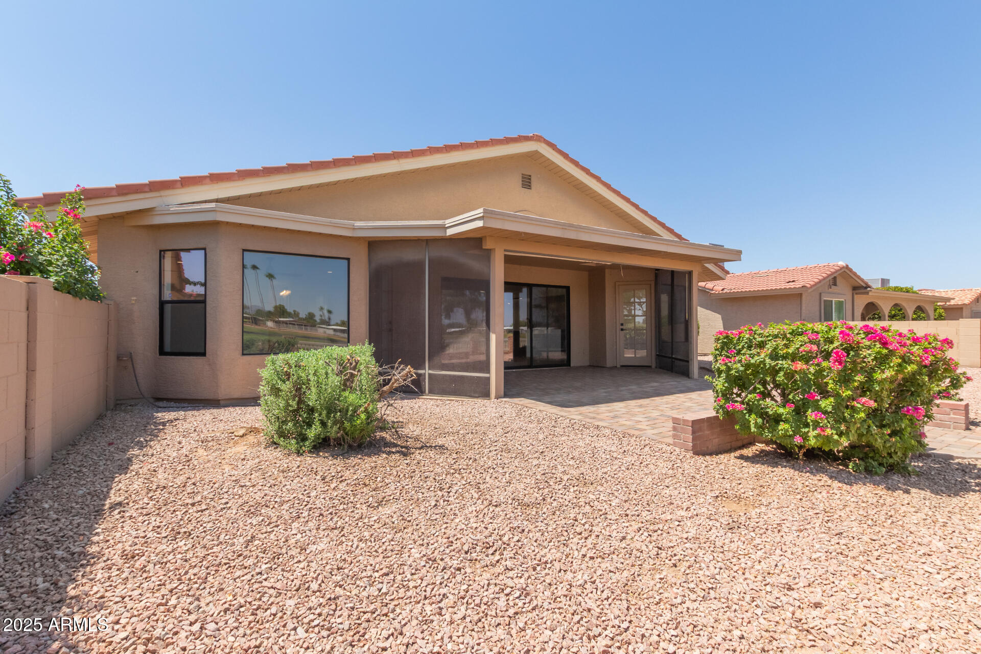 8883 East Fairway Boulevard Sun Lakes, AZ 85248 - Photo 21 of 30 a front view of a house with a yard