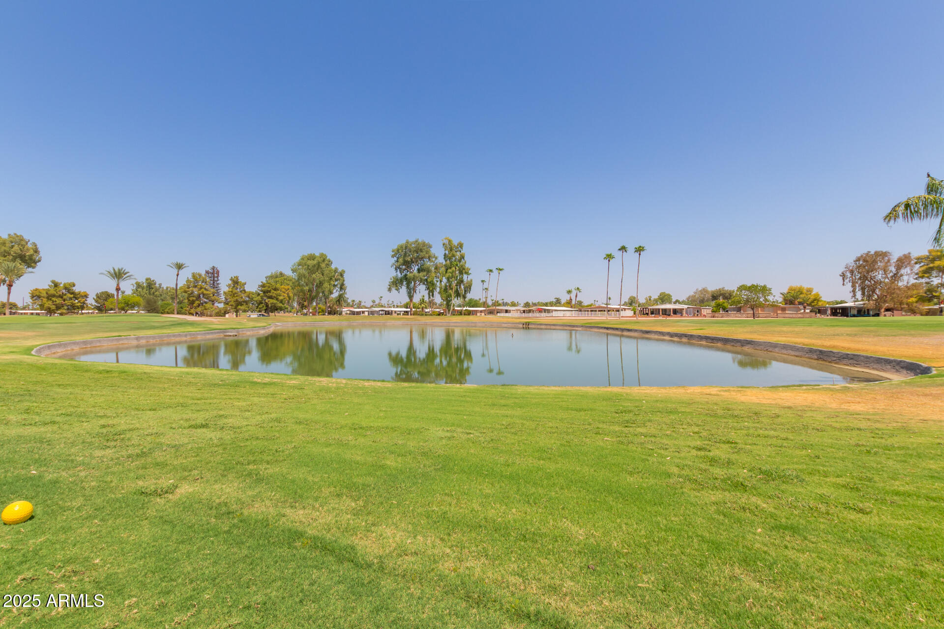 8883 East Fairway Boulevard Sun Lakes, AZ 85248 - Photo 22 of 30 a view of a lake with houses