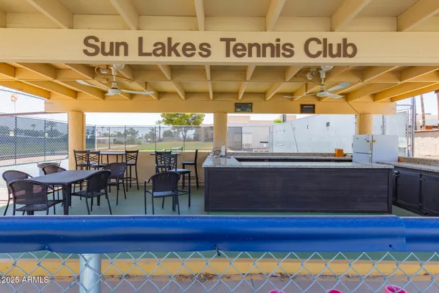 a view of a swimming pool with a table and chairs