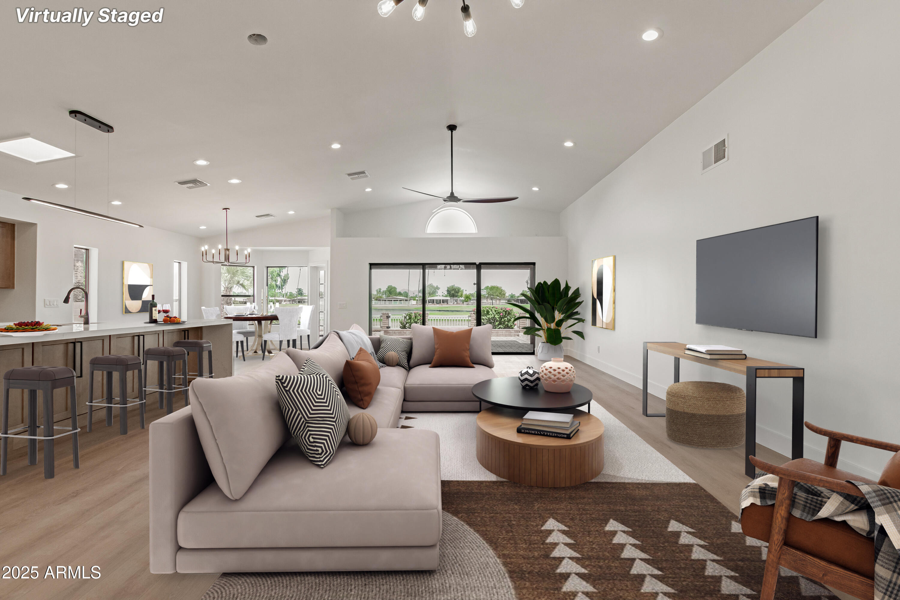 8883 East Fairway Boulevard Sun Lakes, AZ 85248 - Photo 3 of 30 a living room with furniture and a flat screen tv