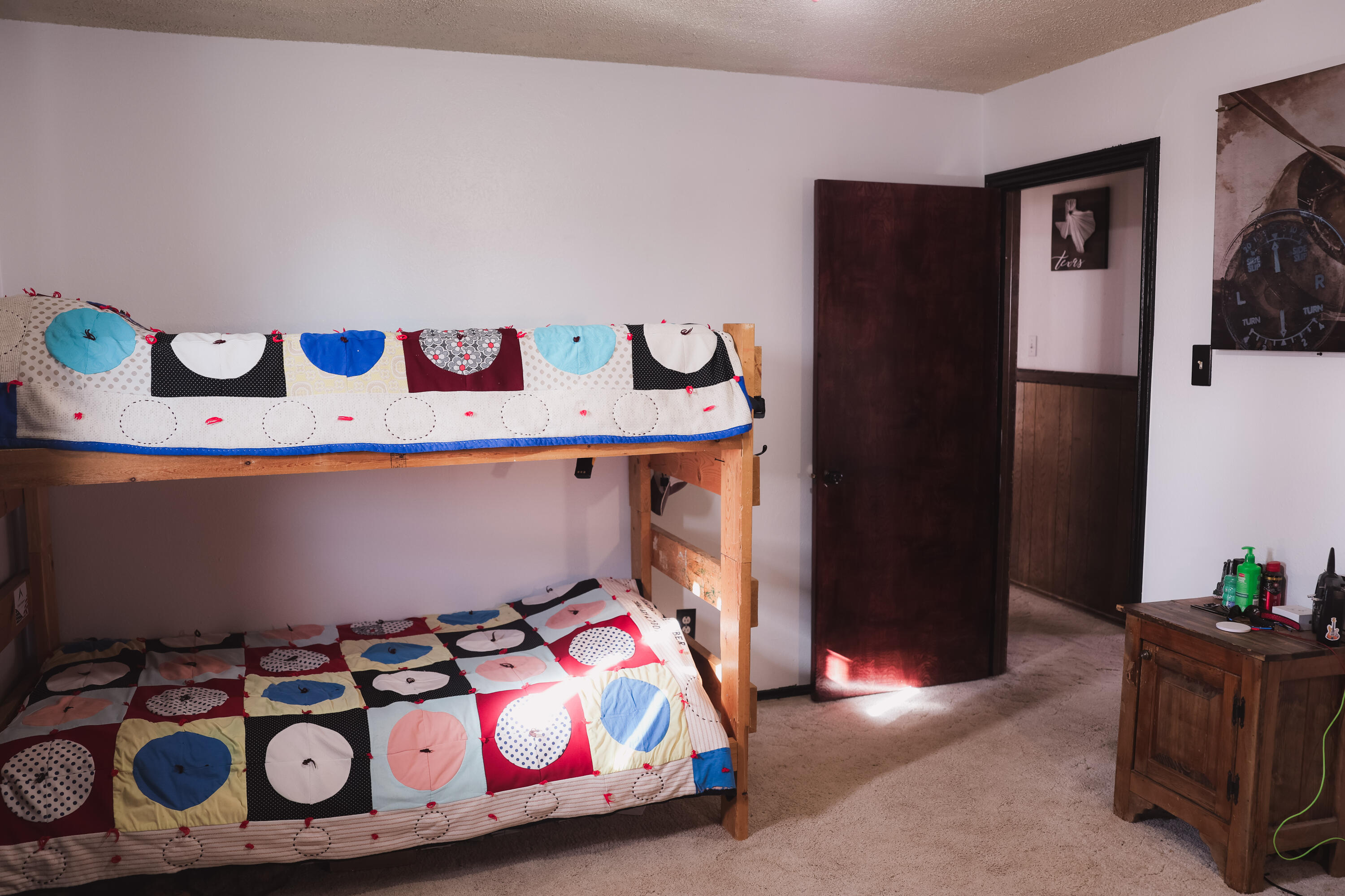 660 County Road K Plainview, TX 79072 - Photo 26 of 66 a bedroom with a bed and a dresser in it