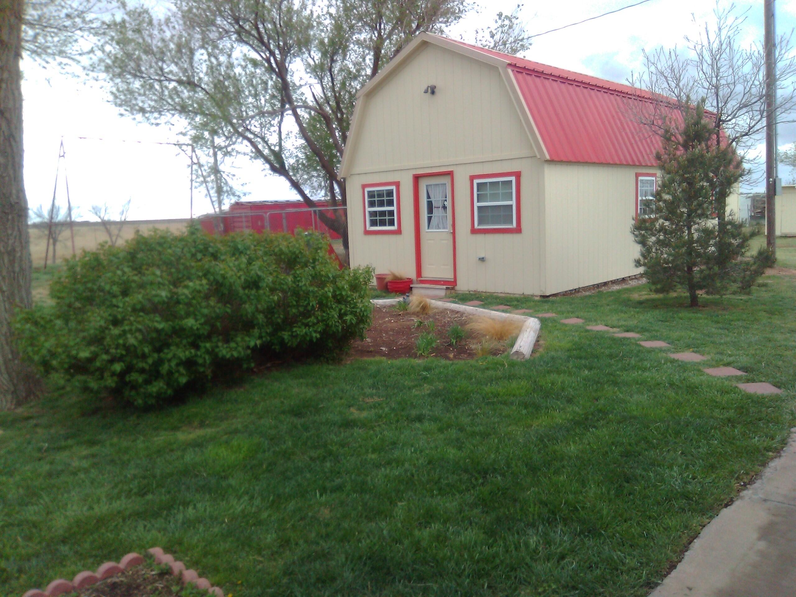 660 County Road K Plainview, TX 79072 - Photo 54 of 66 a view of a house with a yard
