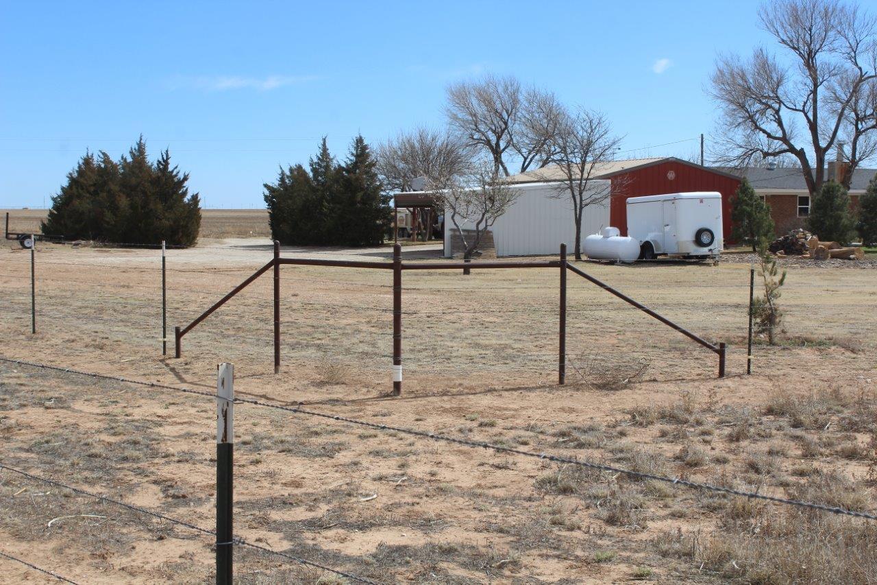 660 County Road K Plainview, TX 79072 - Photo 60 of 66 a view of a house with a yard