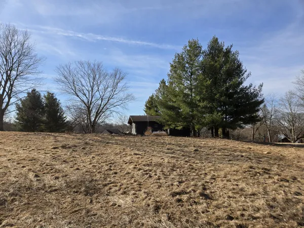 a pathway of a house with a yard