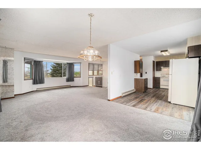 a kitchen with a sink window and cabinets