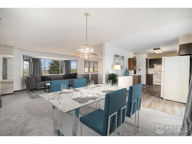 a view of a kitchen with a sink and refrigerator