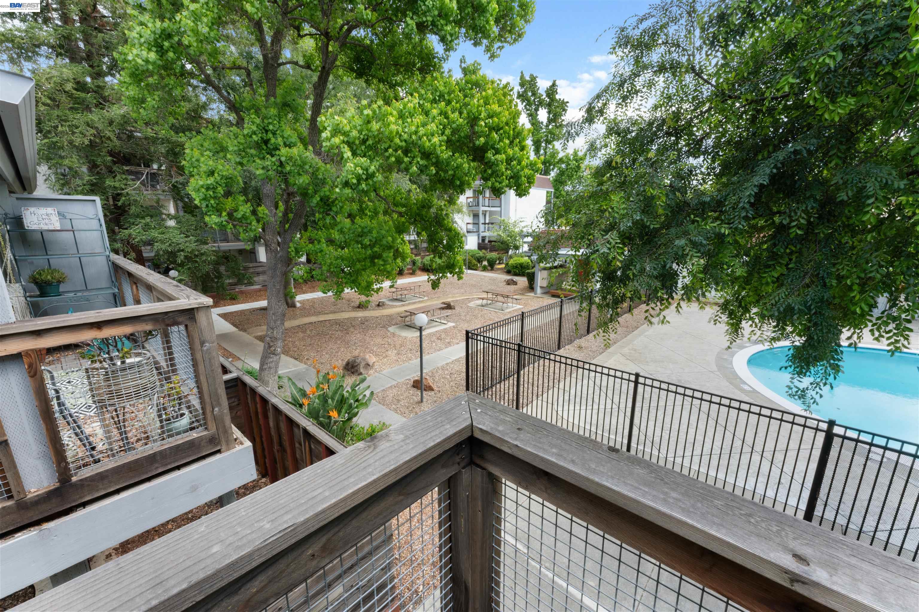 4081 Clayton Road, Unit 221 Concord, CA 94521 - Photo 22 of 23 a view of balcony with wooden floor and fence