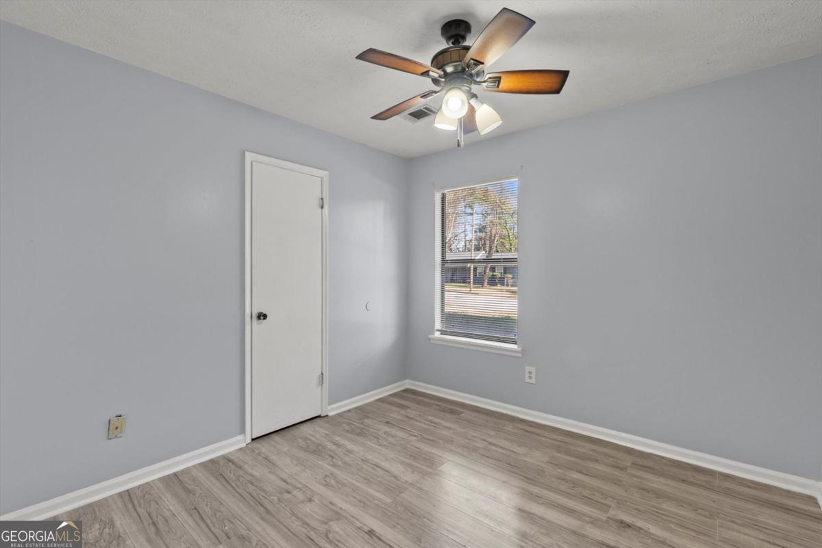 8877 Burnham Way Jonesboro, GA 30238 - Photo 14 of 23 a view of an empty room with a window