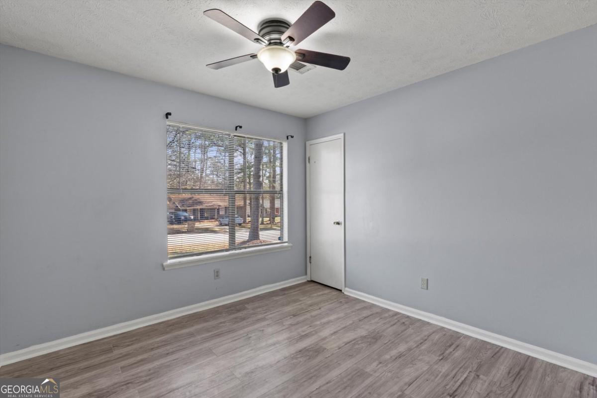 8877 Burnham Way Jonesboro, GA 30238 - Photo 16 of 23 a view of an empty room with a window