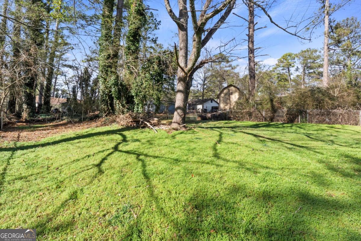 8877 Burnham Way Jonesboro, GA 30238 - Photo 22 of 23 a view of a park with large trees