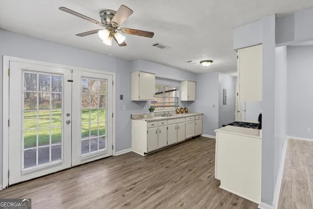 a kitchen with a stove a sink and a refrigerator