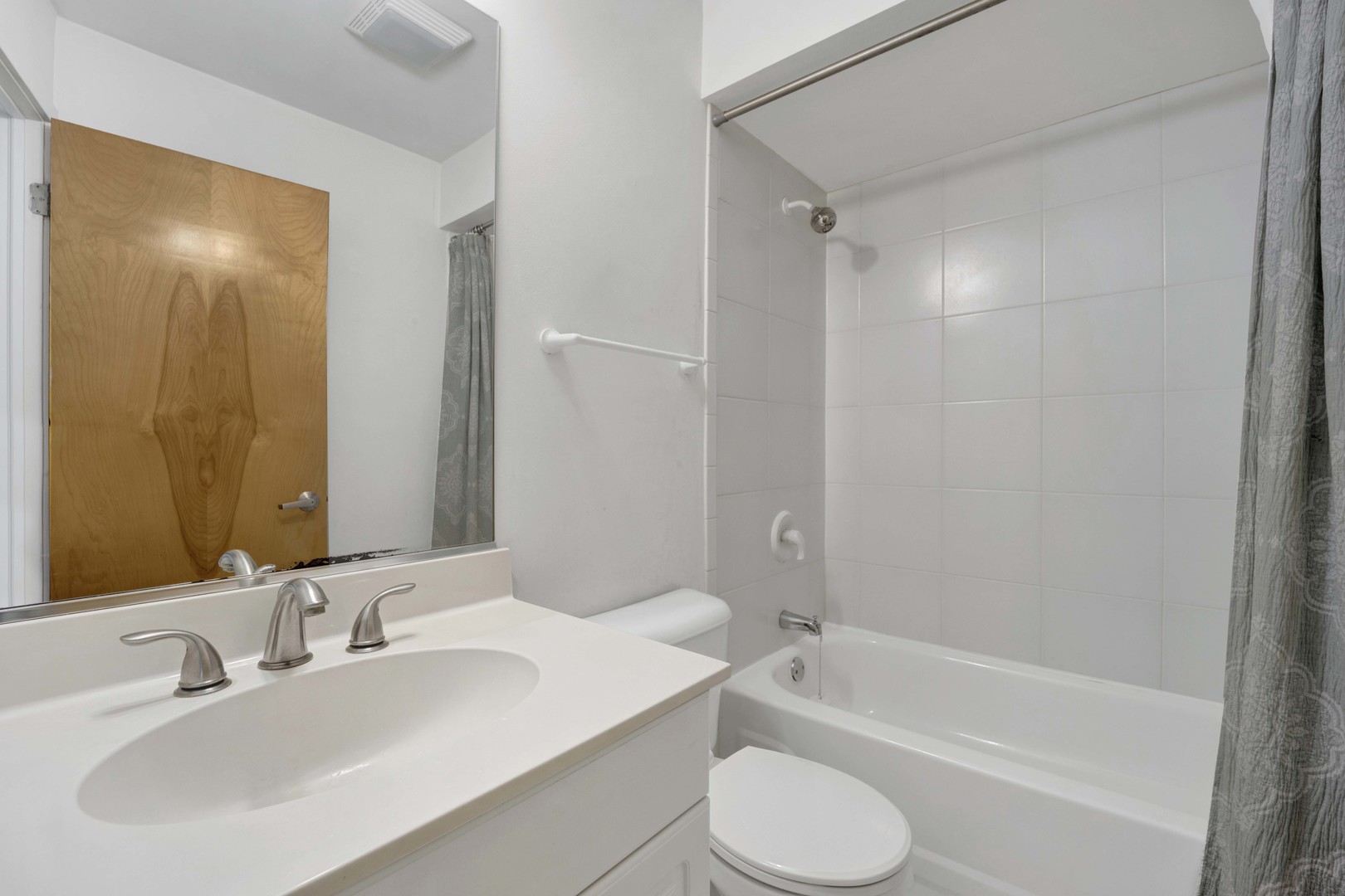 1812 South State Street, Unit 3 Chicago, IL 60616 - Photo 17 of 29 a bathroom with a tub shower sink vanity and toilet
