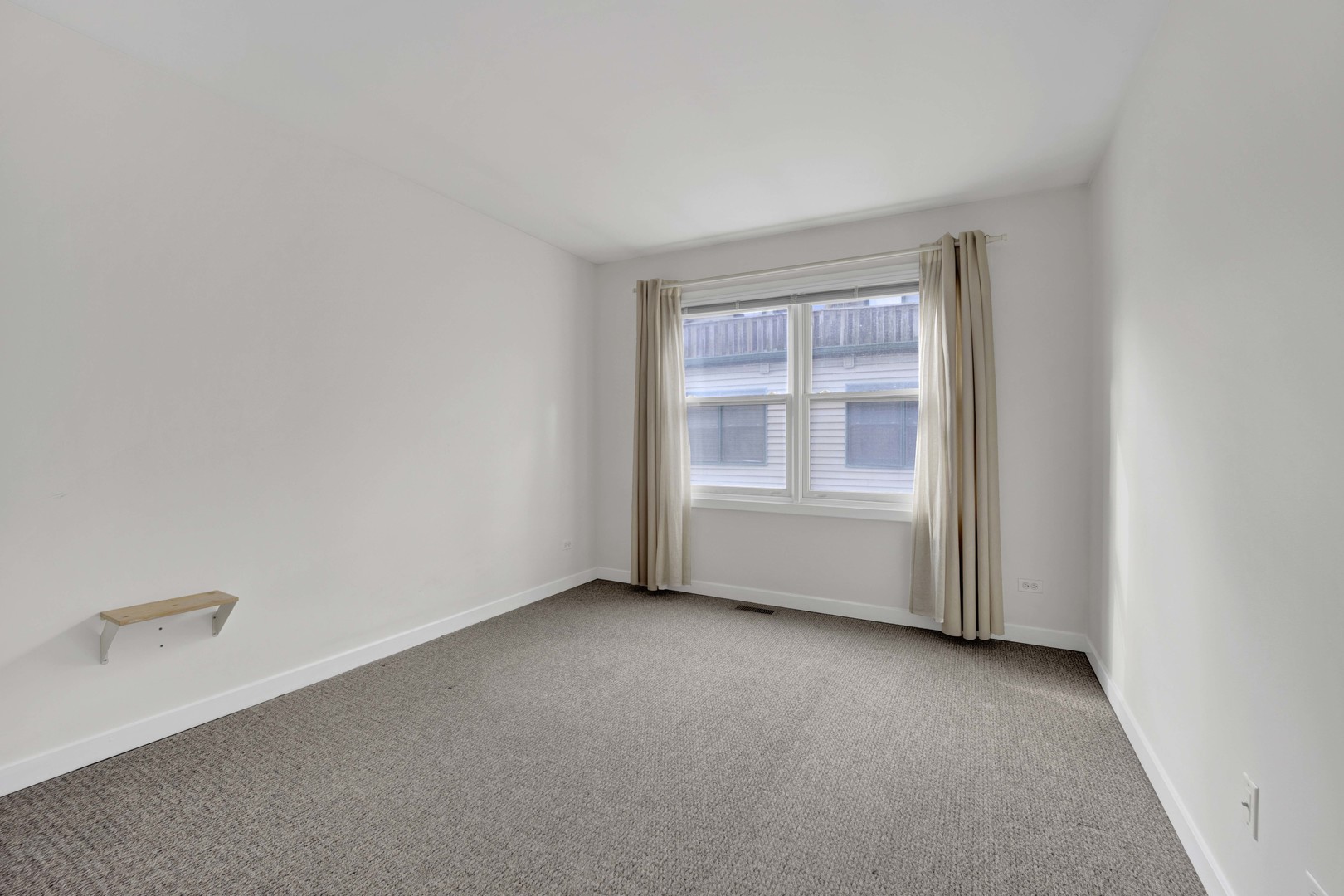 1812 South State Street, Unit 3 Chicago, IL 60616 - Photo 19 of 29 a view of an empty room with a window