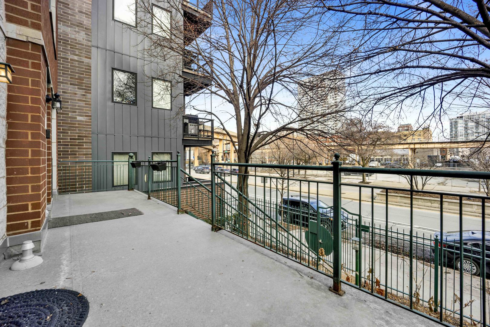 1812 South State Street, Unit 3 Chicago, IL 60616 - Photo 26 of 29 a view of a street with wooden fence