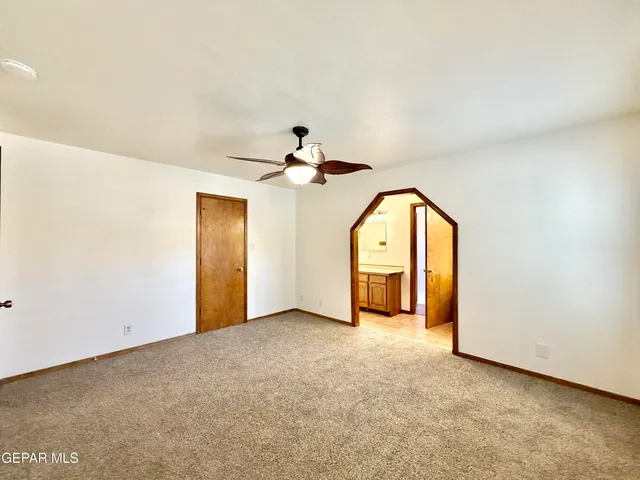 a kitchen with stainless steel appliances kitchen island a chandelier