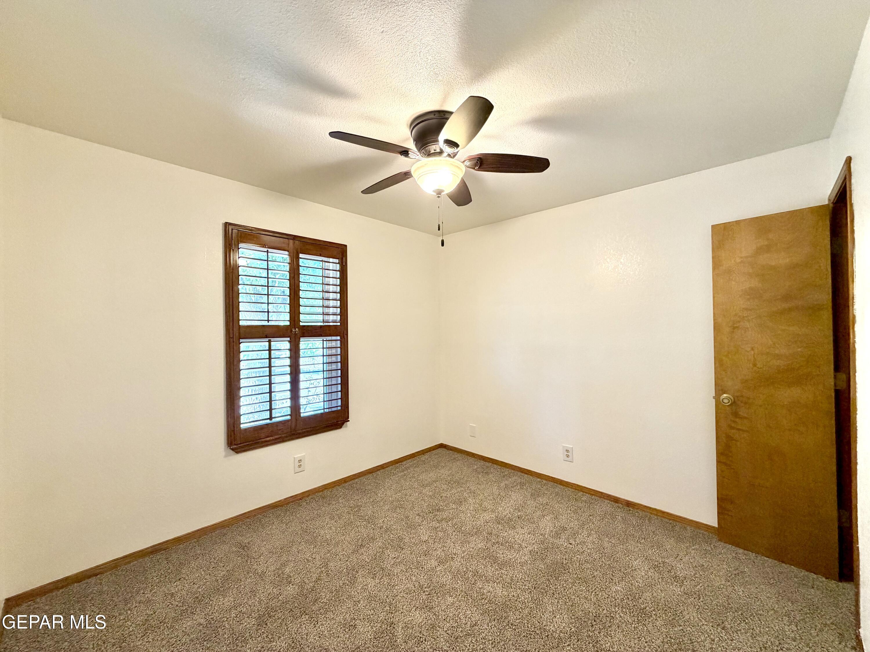 2452 West Ohara Road Anthony, NM 88021 - Photo 23 of 56 a view of an empty room with a window