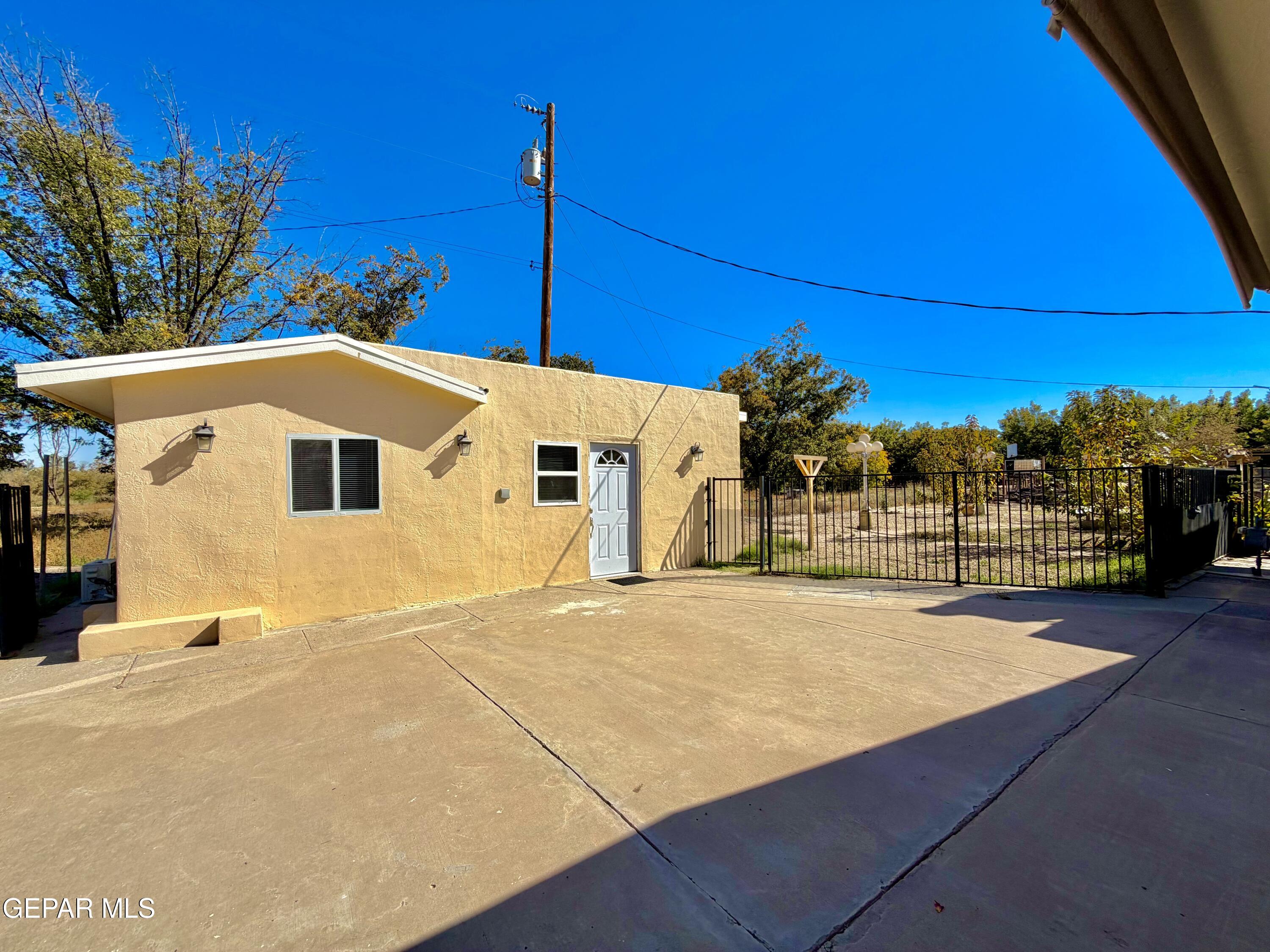 2452 West Ohara Road Anthony, NM 88021 - Photo 36 of 56 a view of a house with a backyard
