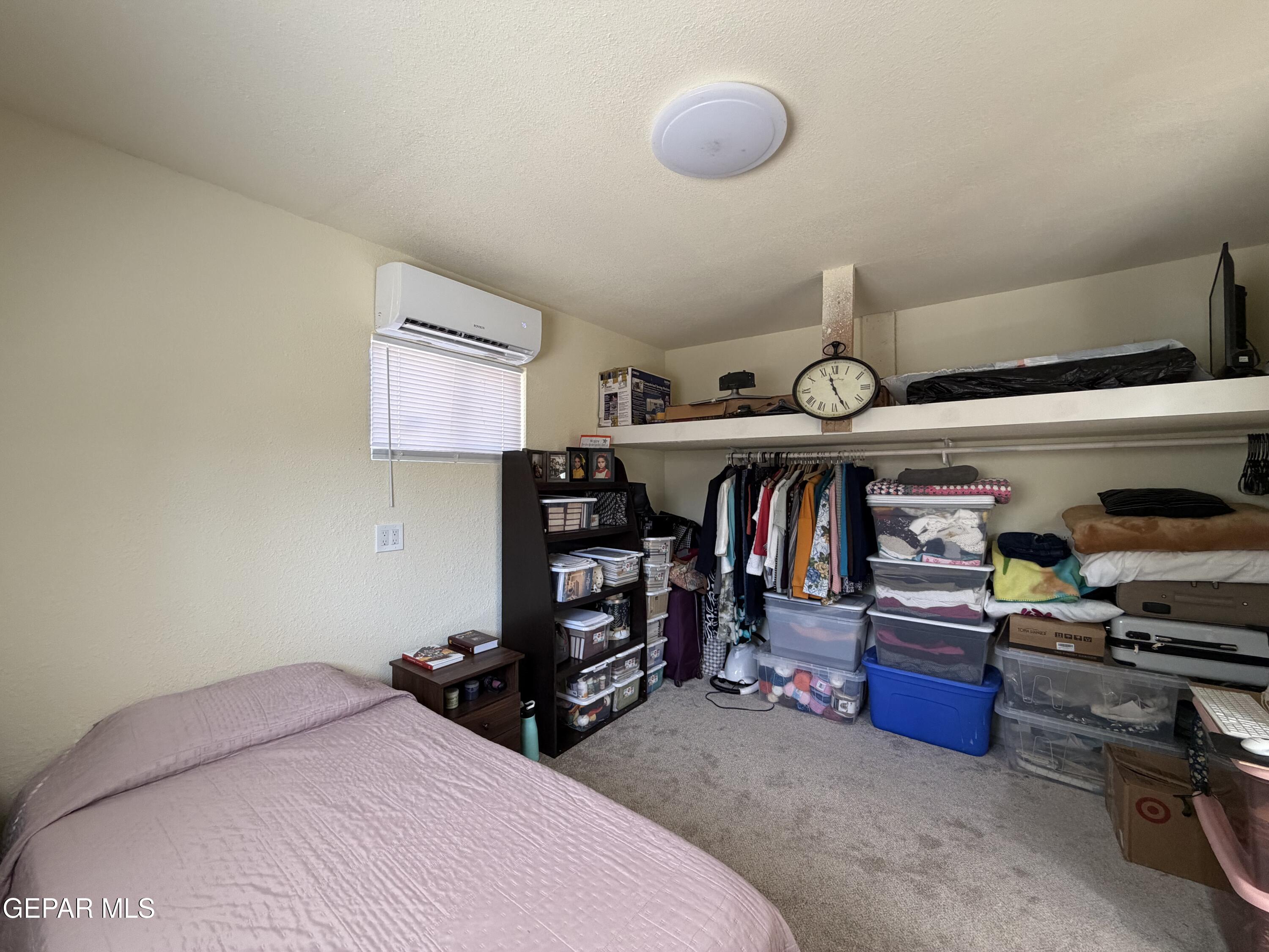 2452 West Ohara Road Anthony, NM 88021 - Photo 39 of 56 a bedroom with a bed and a closet