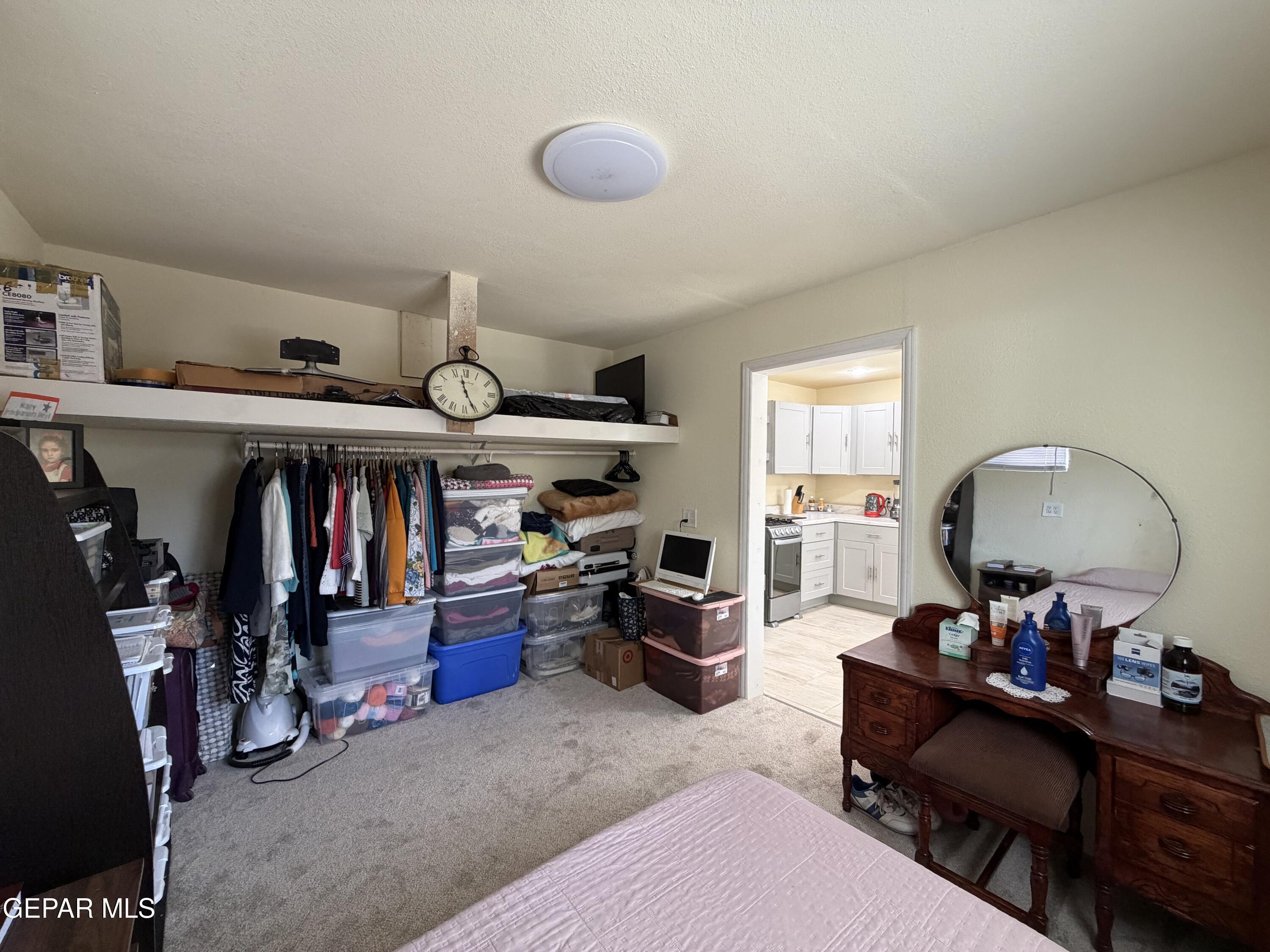 2452 West Ohara Road Anthony, NM 88021 - Photo 40 of 56 a living room with lots of furniture and a mirror