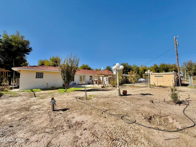 a view of a swimming pool with chairs