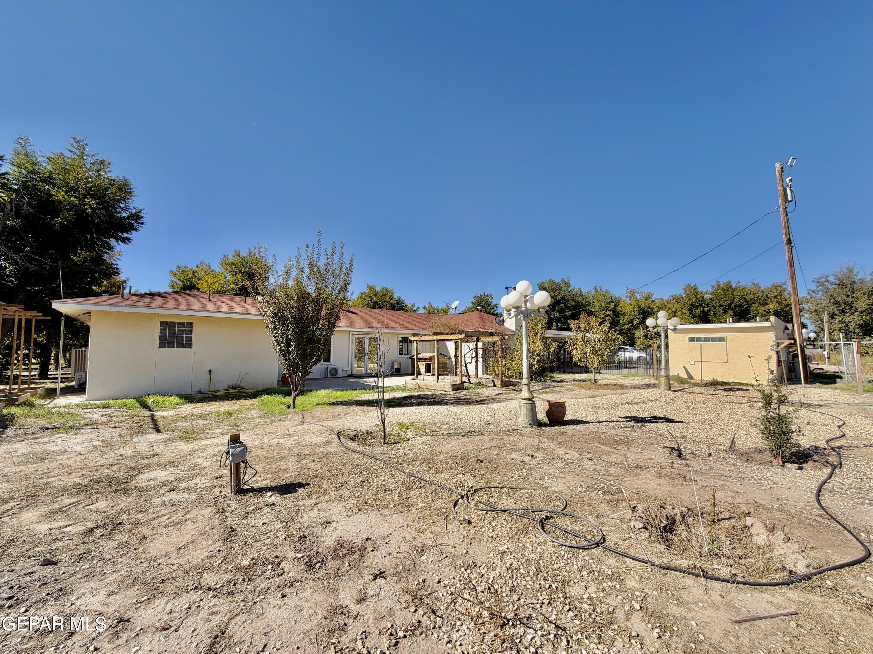2452 West Ohara Road Anthony, NM 88021 - Photo 44 of 56 a view of a house with a yard