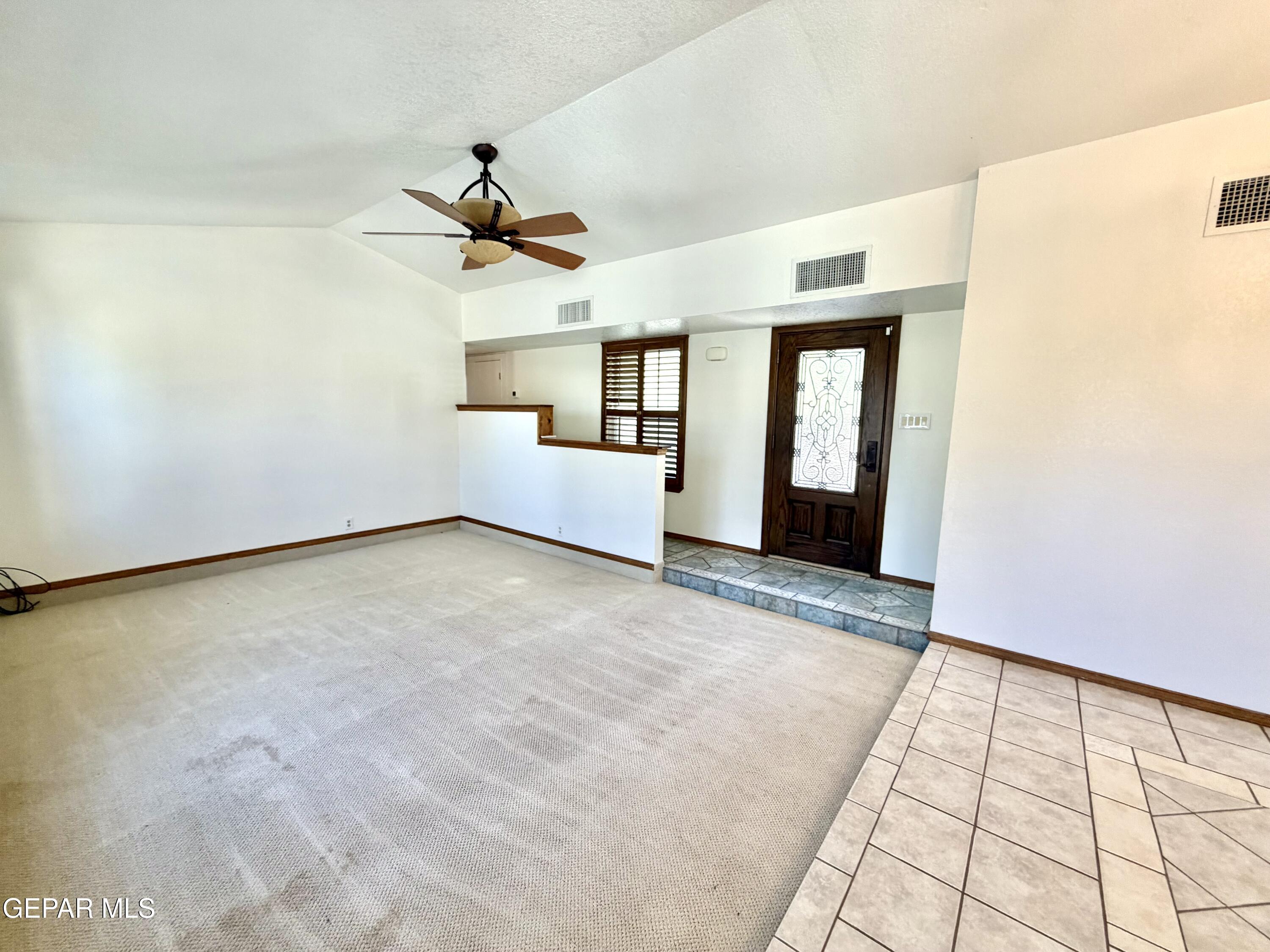2452 West Ohara Road Anthony, NM 88021 - Photo 10 of 56 a view of a livingroom with a ceiling fan and window