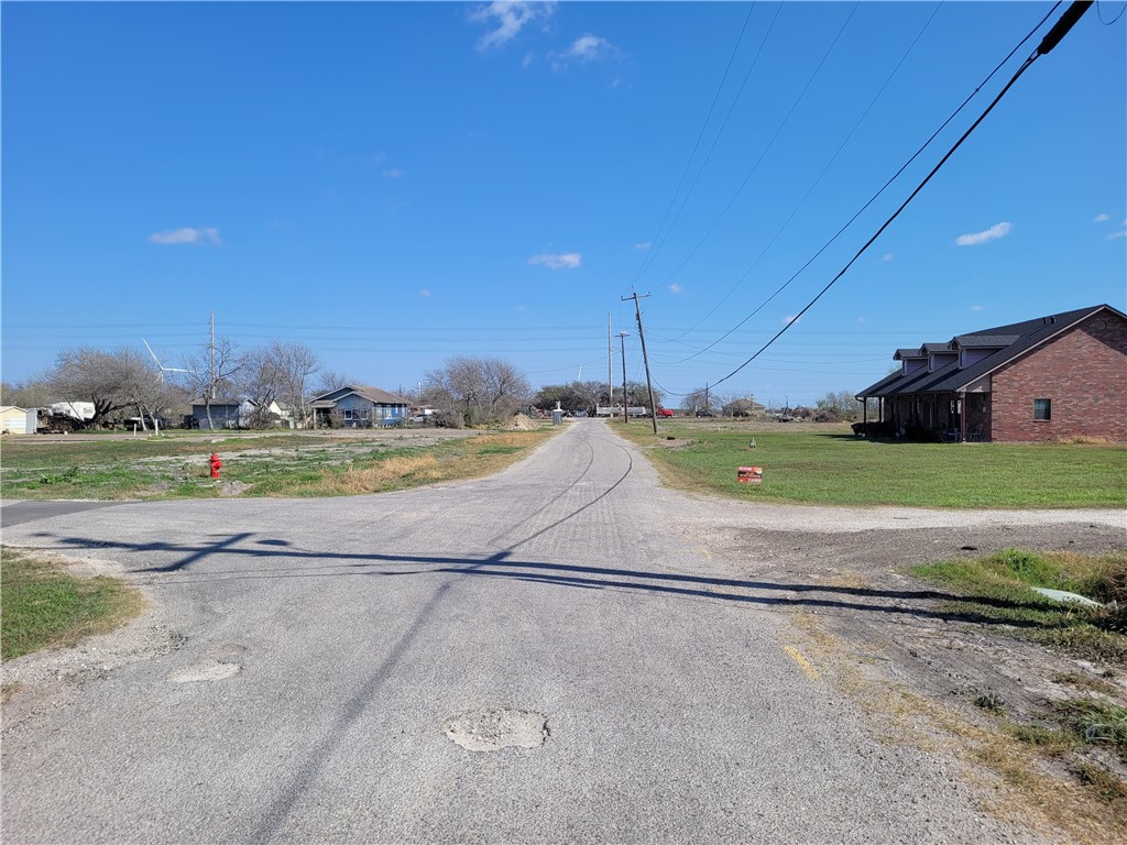 205 Polk Street Gregory, TX 78374 - Photo 2 of 5 a view of a road with a building in the background