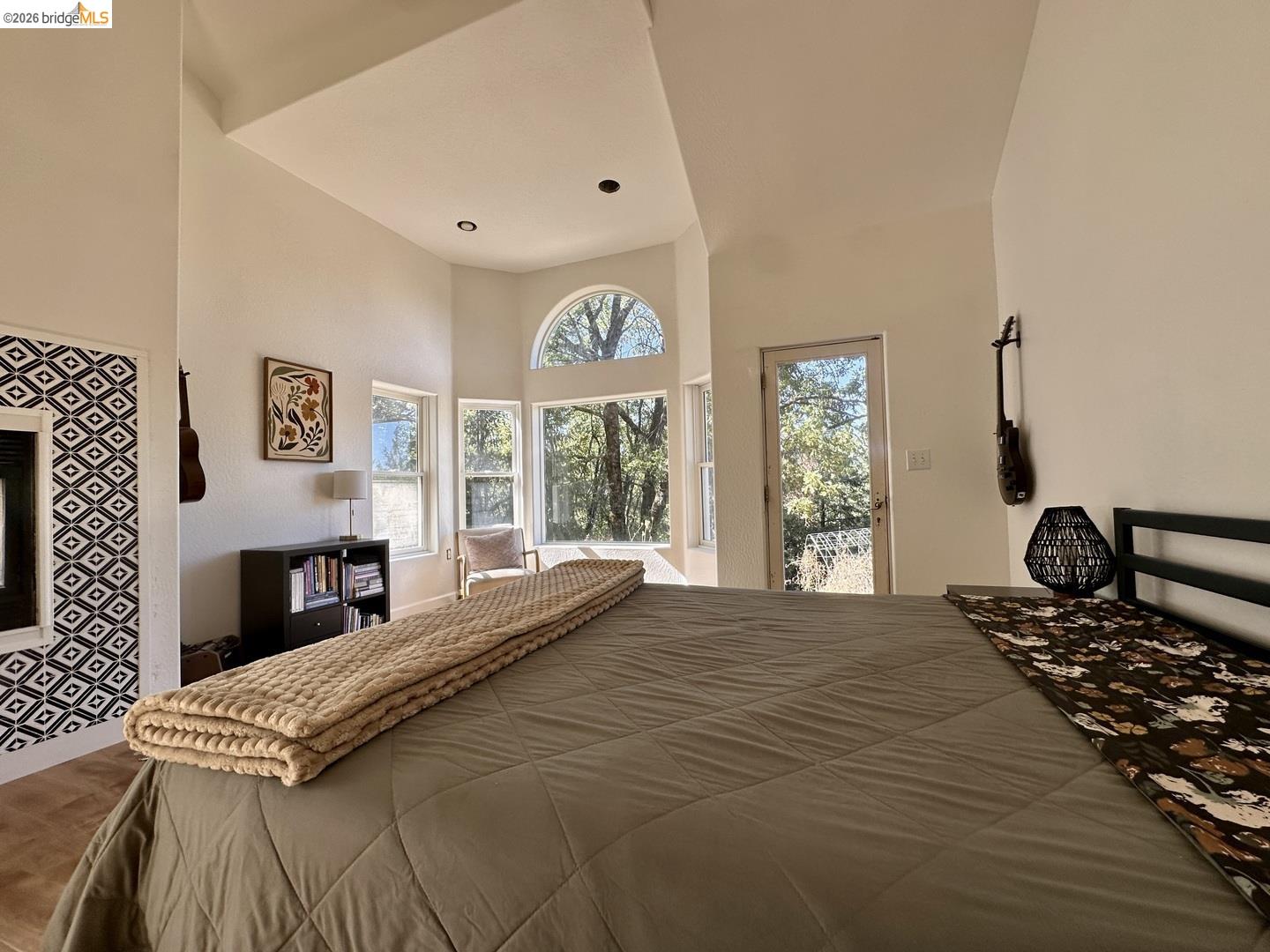 2080 Nelson Road Camino, CA 95709 - Photo 29 of 55 Vaulted ceiling with recessed lighting, bay window feature, arched transom window, French door access, and patterned wall accent