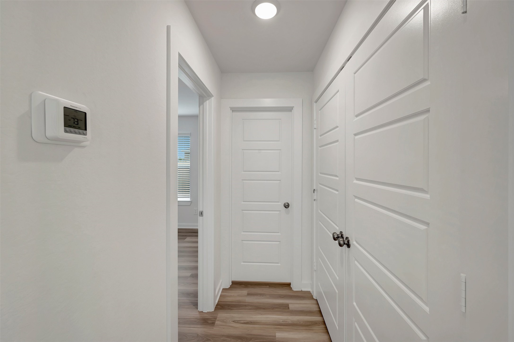 543 Flower Reed Court Magnolia, TX 77354 - Photo 30 of 46 a view of a hallway with wooden floor and entryway