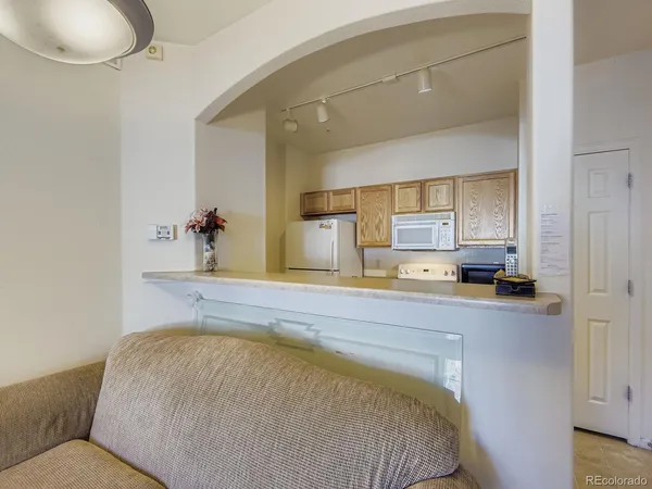 a bed room with a bed and mirror