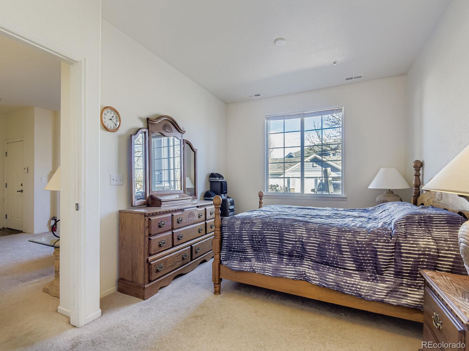 5255 Memphis Street, Unit 307 Denver, CO 80239 - Photo 4 of 29 a bedroom with a bed and a window