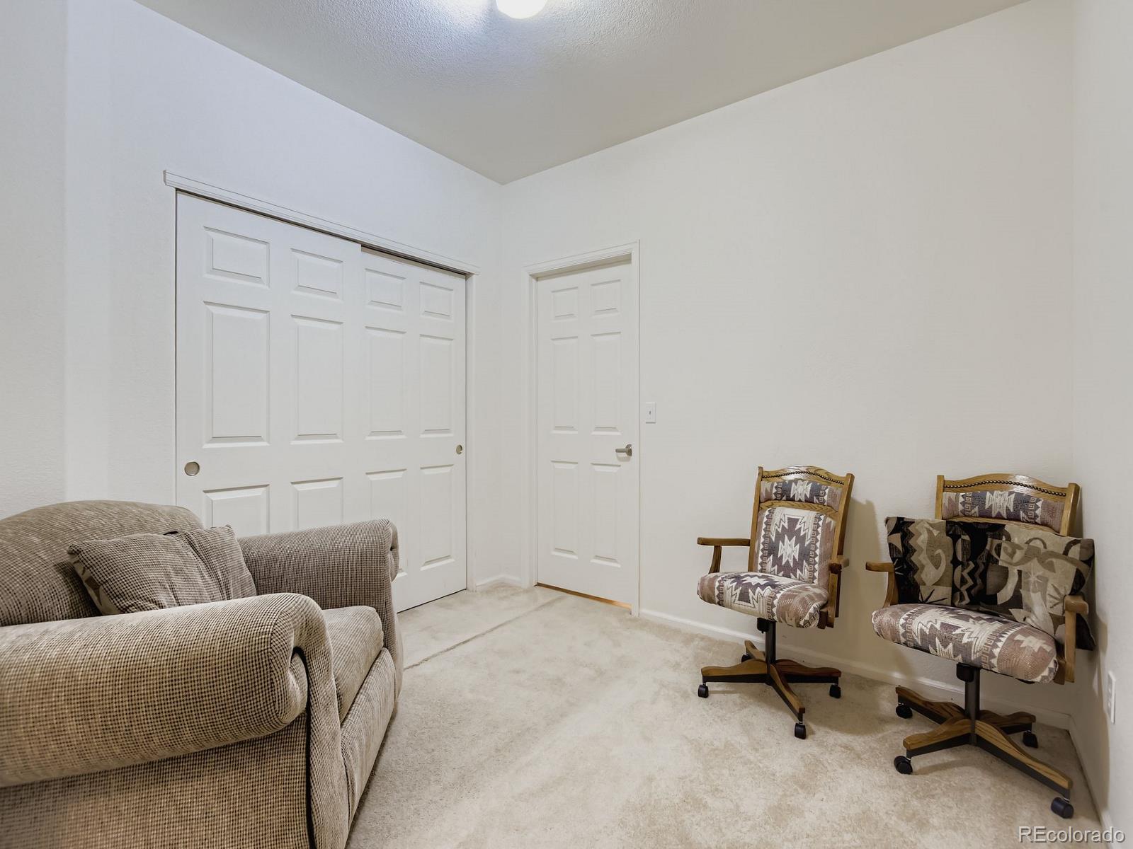 5255 Memphis Street, Unit 307 Denver, CO 80239 - Photo 6 of 29 a living room with furniture