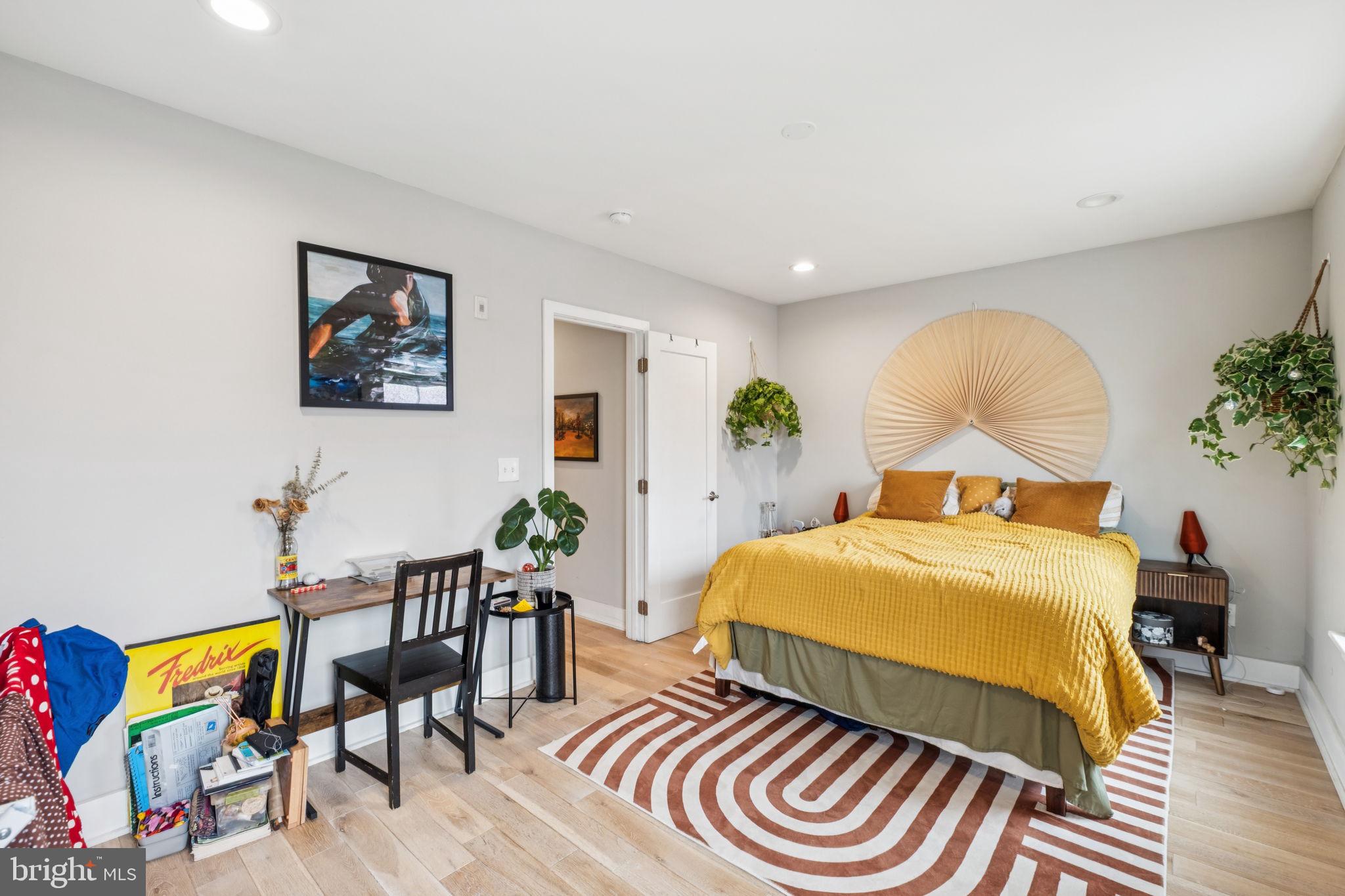 1516 Green Street Philadelphia, PA 19130 - Photo 12 of 36 a bedroom with a bed and a painting on the wall