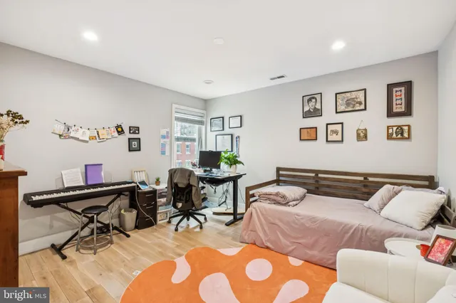 a bedroom with furniture and a bed