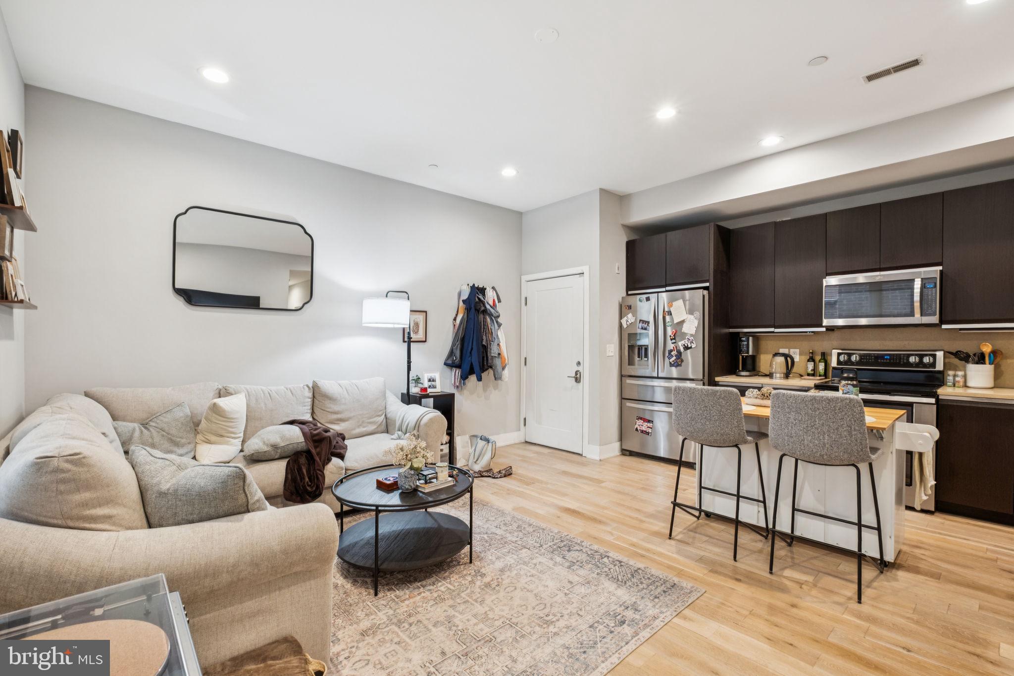 1516 Green Street Philadelphia, PA 19130 - Photo 21 of 36 a living room with furniture and a wooden floor