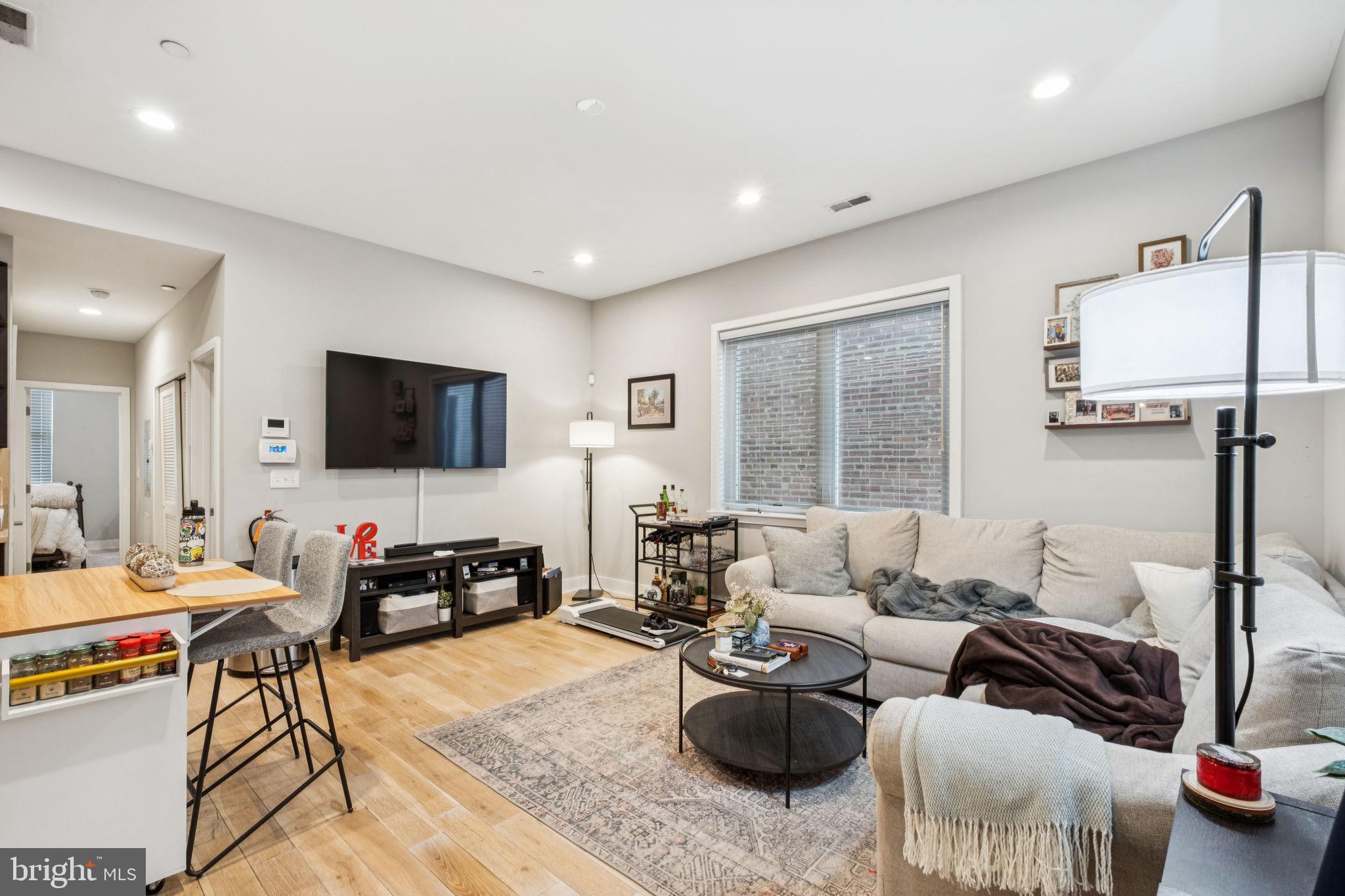 1516 Green Street Philadelphia, PA 19130 - Photo 22 of 36 a living room with furniture and a flat screen tv