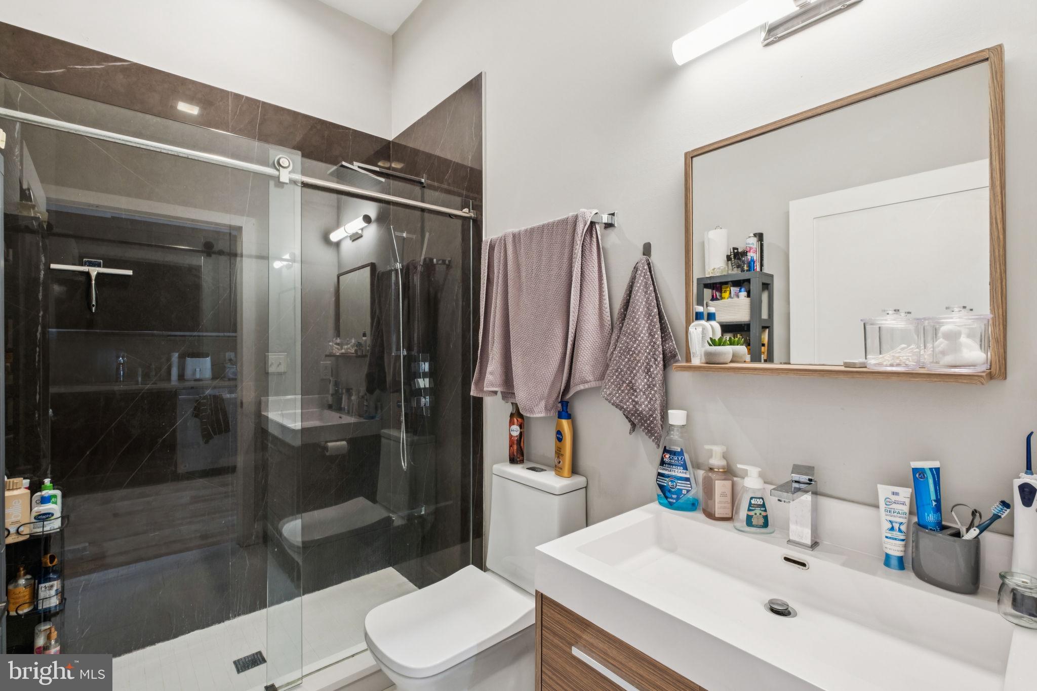 1516 Green Street Philadelphia, PA 19130 - Photo 25 of 36 a bathroom with a sink toilet and shower