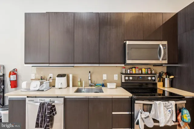 a kitchen with a stove and a microwave
