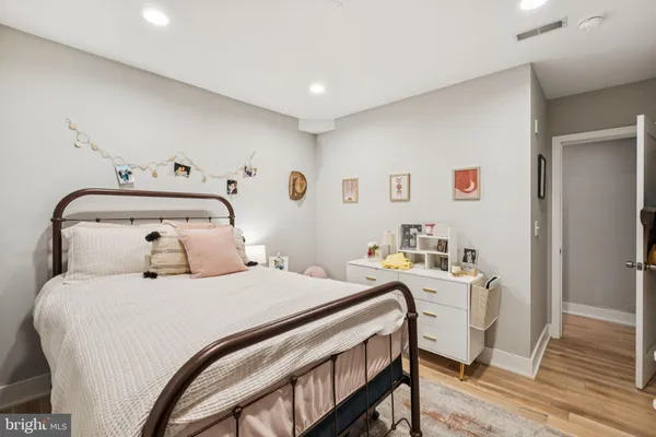 a bedroom with a bed and a table in it