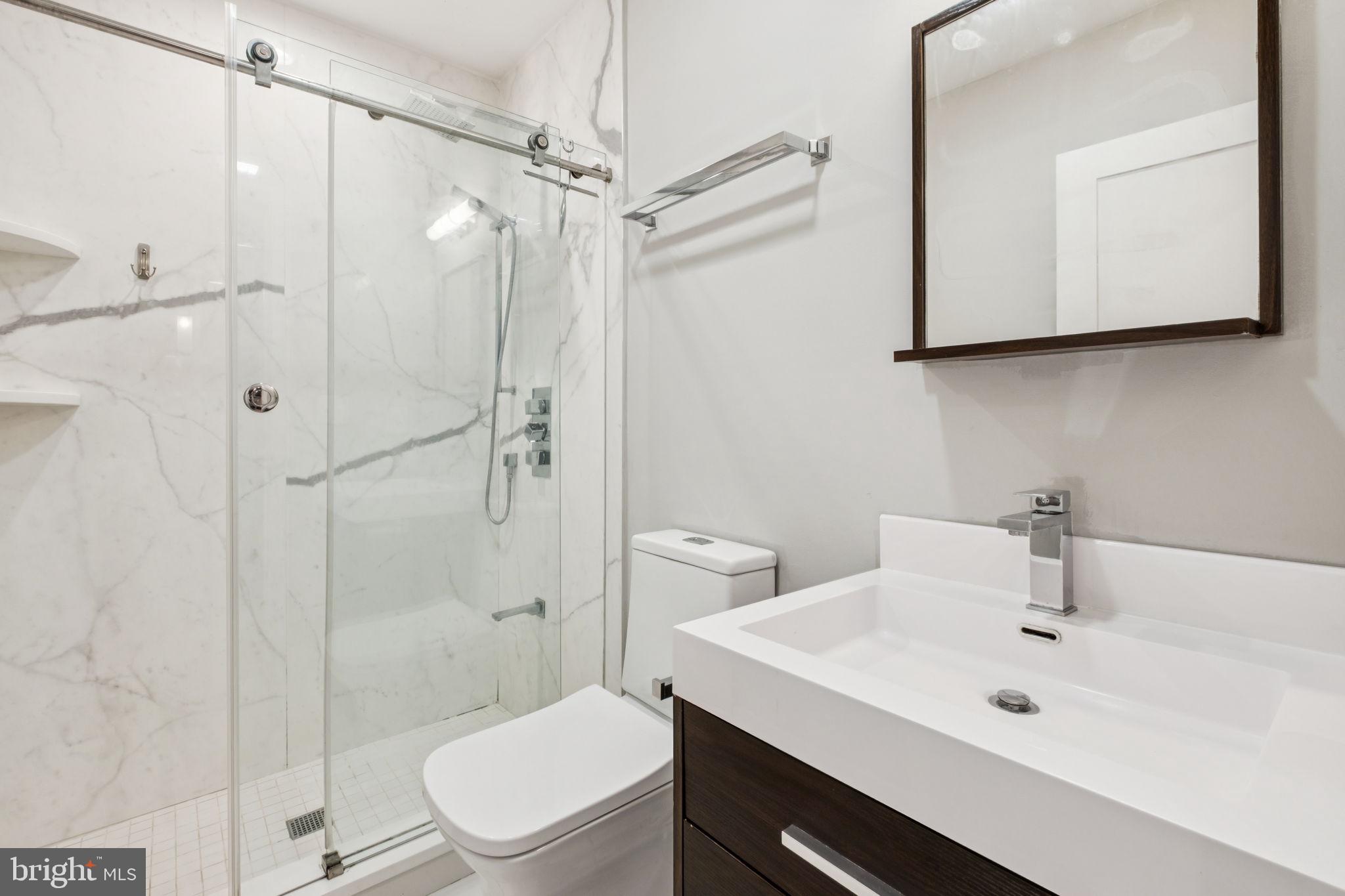 1516 Green Street Philadelphia, PA 19130 - Photo 6 of 36 a bathroom with a sink toilet and shower