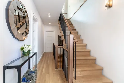 a view of entryway with wooden floor