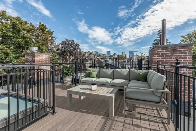 a view of roof deck with patio