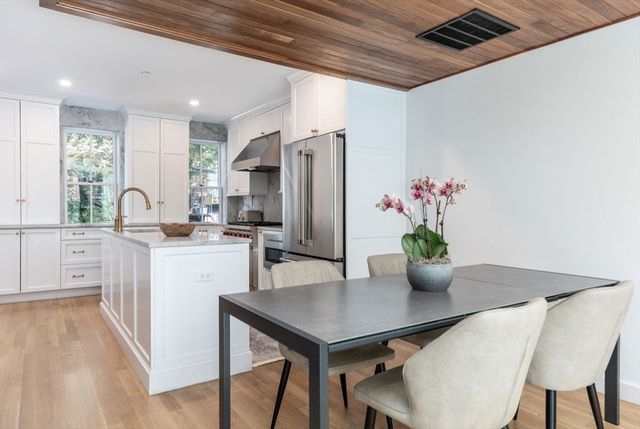 a kitchen with a table and chairs