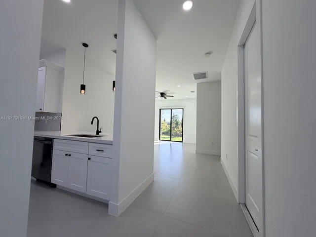 a view of a hallway with front door